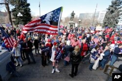 Supporters of President Donald Trump gather during a March 4 Trump rally on the state Capitol steps in Denver, March 4, 2017.