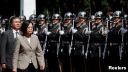 FILE - Taiwanese President Tsai Ing-wen inspects honor guard in Taiwan. President Tsai set off Friday for two friendly nations in Latin America.