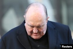 FILE - Archbishop Philip Wilson arrives at Newcastle Local Court in Newcastle, Australia, May 22, 2018.