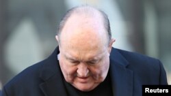 FILE - Archbishop Philip Wilson arrives at Newcastle Local Court in Newcastle, Australia, May 22, 2018.