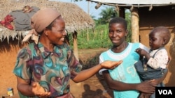 Sister Angelique Namaika with one of the displaced women she works with in Dungu, DRC, July 10, 2013. (Hilary Heuler for VOA)