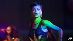Barbadian singer Rihanna performs during the fifth stop of her 777 worldwide tour at the E-Werk club in Berlin, Nov. 19, 2012.