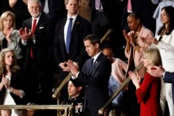 Venezuelan opposition leader Juan Guaido applauds as President Donald Trump delivers his State of the Union address to a joint session of Congress on Capitol Hill in Washington, Tuesday, Feb. 4, 2020. (AP Photo/Patrick Semansky)