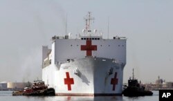 FILE - The Navy hospital ship USNS Comfort returns to port in Baltimore, March 19, 2010.