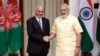 FILE - Indian Prime Minister Narendra Modi, right, shakes hands with Afghan President Ashraf Ghani in New Delhi, India, Sept. 14, 2016.