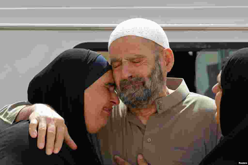 Abu Qatada&#39;s father and a family member wait for his release after his acquittal is announced, Amman, Sept. 24, 2014. 
