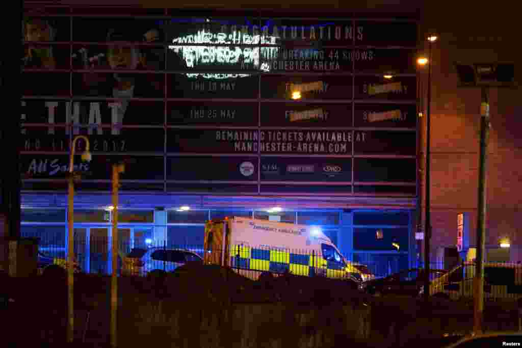A police van and an ambulance are seen outside the Manchester Arena, where U.S. singer Ariana Grande had been performing, in Manchester, northern England, Britain May 22, 2017. 