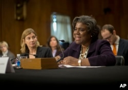 FILE - U.S. Assistant Secretary of State for African Affairs Linda Thomas-Greenfield, right, accompanied by USAID Assistant Administrator for Bureau for Democracy Conflict and Humanitarian Assistance Nancy Lindborg, testifies on Capitol Hill, Jan. 9, 2014.