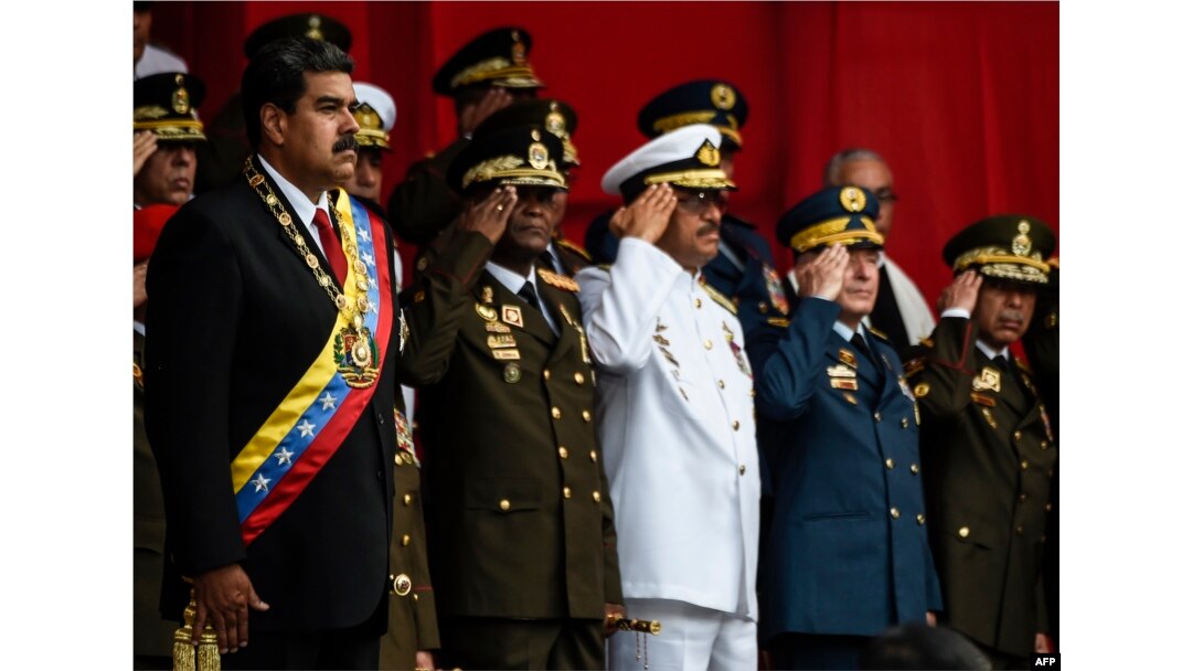 Venezuelan President Nicolas Maduro, left, and members of the military high command attend a military honor ceremony in Caracas on May 24, 2018.