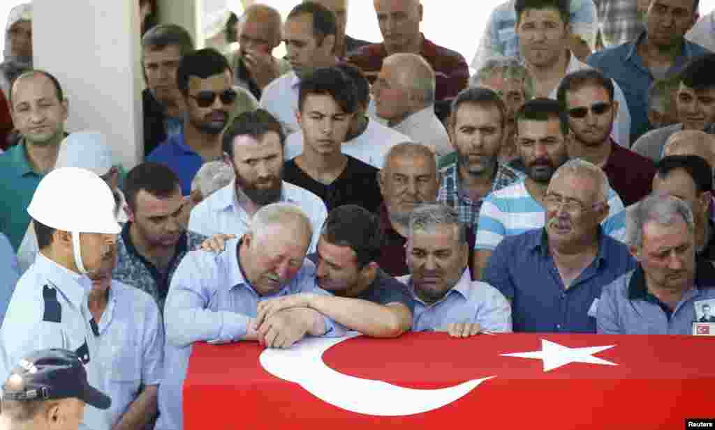 An elderly man mourns during a funeral ceremony for a killed Turkish police officer in Ankara, Turkey, July 18, 2016.
