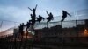 Spain Says 52 Migrants Climb Fence into Its African Enclave