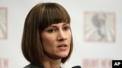 Rachel Crooks speaks at a news conference, Monday, Dec. 11, 2017, in New York to discuss her accusations of sexual misconduct against Donald Trump.
