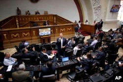 FILE - Opposition lawmaker Richard Blanco speaks during a session at the National Assembly in Caracas, Venezuela, Aug. 1, 2017. The president of the opposition-led National Assembly, Julio Borges, told Venezuela that Maduro's foes would continue protesting until they won free elections and a change of government.