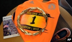 A gold laurel wreath, which is awarded to the winner of the Boston Marathon, is displayed at the Boston Athletic Association in Boston, April 1, 2015. The wreath, and other historic items from the race, will be on display when RunBase opens.