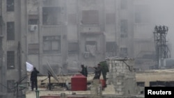 Thành viên của Quân đội Giải phóng Syria tại một khu vực trong thủ đô Damascus, ngày 6/2/2013.