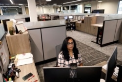 Shobha Surya, associate manager for projects and sales operations of Ajinomoto, a global food and pharmaceutical company, works in a shared office space in Itasca, Ill., Monday, June 7, 2021.