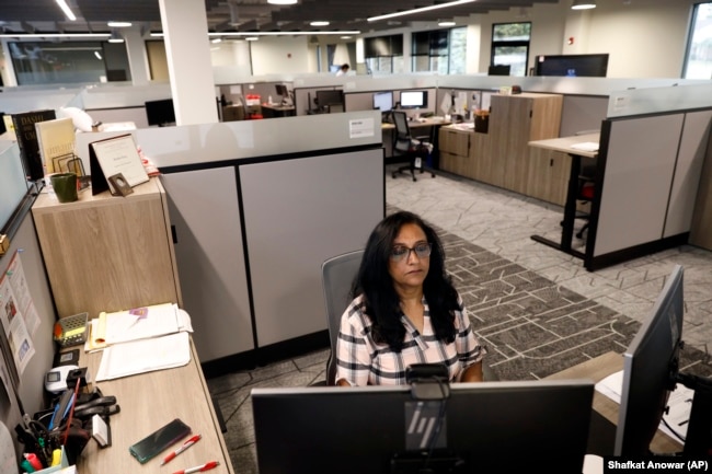 Shobha Surya, associate manager for projects and sales operations of Ajinomoto, a global food and pharmaceutical company, works in a shared office space in Itasca, Ill., Monday, June 7, 2021.