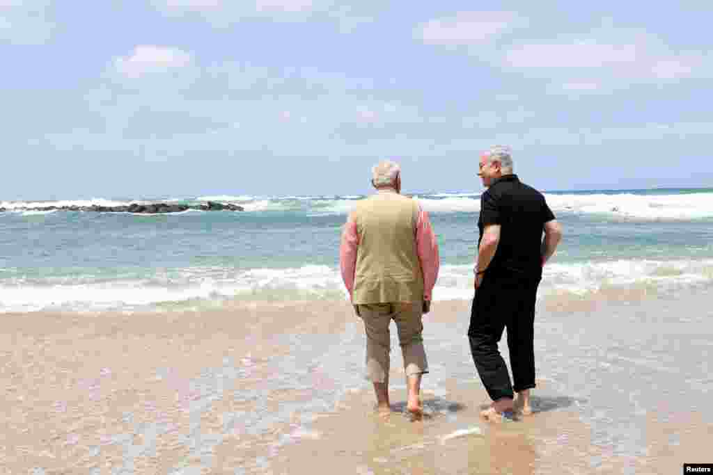 Israel's Prime Minister Benjamin Netanyahu (R) and India's Prime Minister Narendra Modi visit Olga Beach and a water-desalination unit operated by G.A.L. Water Technologies, near Hadera, Israel.