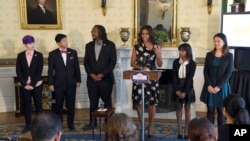 First lady Michelle Obama speaks in the Blue Room of the White House in Washington, Oct. 8, 2015, during an event to honor the 2015 class of the National Student Poets Program (NSPP), the nation’s highest honor for youth poets.