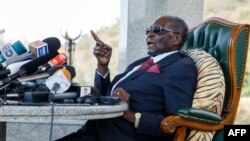 FILE: Zimbabwe's former President Robert Mugabe speaks during a press conference held at his "Blue Roof" residence, in Harare, on July 29, 2018. 