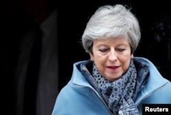 Britain's Prime Minister Theresa May leaves 10 Downing Street, ahead of votes on Brexit options, in London, March 27, 2019.