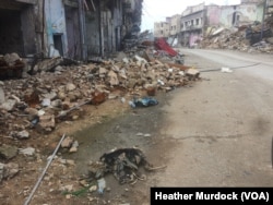 Remains of IS militants in the streets and people's homes are commonly found in Old Mosul, Iraq on March 1, 2018 as authorities work to bury the bodies.