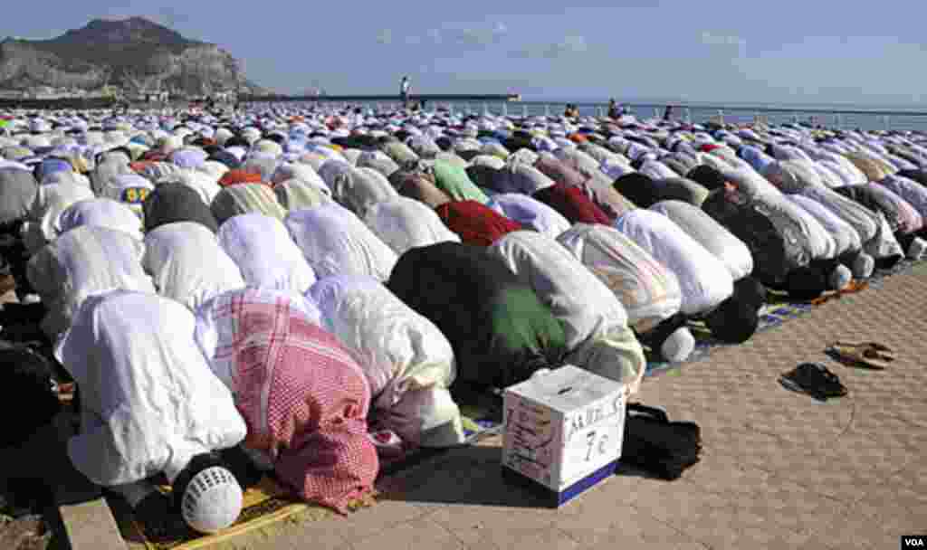 Muslims attend the Eid al-Fitr prayers in the Sicilian town of Palermo, Italy, Aug. 30, 2011. AP