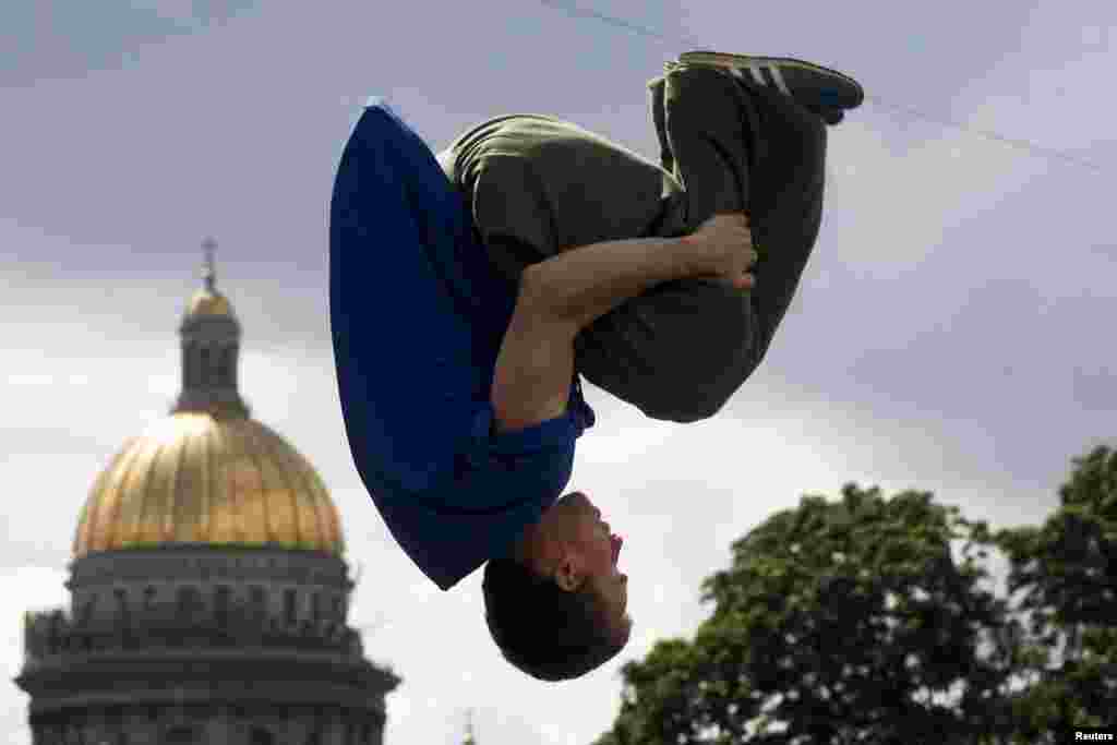 A participant jumps in front of St. Isaac&#39;s Cathedral during a festival of youth street culture in St.Petersburg, Russia.