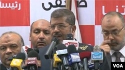 Muslim Brotherhood's Morsi Claims Win, Egypt's Military Claims Powers