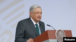 FILE - Mexico's President Andres Manuel Lopez Obrador speaks before the traditional military parade to mark the bicentennial of Mexico's Independence from Spain, at the Zocalo square in Mexico City, Sept. 16, 2021.
