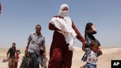 An estimated 200,000 Syrian Kurds fleeing poverty and civil war have sought refuge in Iraq and Iraqi Kurdistan. These refugees crossed the border at Peshkhabour check point, 260 miles from Baghdad, on August 20, 2013.