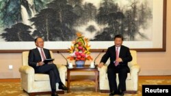 世界银行行长金墉2018年7月16日在北京钓鱼台国宾馆与中国国家主席习近平会面。