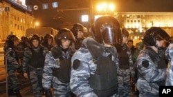 Police arrive at Triumphal Square during protests against alleged vote rigging in Russia's parliamentary elections in Moscow, Russia, December 6, 2011.