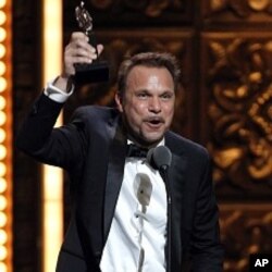 Norbert Leo Butz accepts the Tony Award for Best Performance by an Actor in a Leading Role in a Musical for "Catch Me If You Can" during the 65th annual Tony Awards, Sunday, June 12, 2011 in New York.