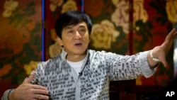 Action star Jackie Chan speaks during an interview in Beijing, Aug. 3, 2015. 