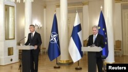 FILE - NATO Secretary General Jens Stoltenberg and Finland's President Sauli Niinistö hold a joint news conference in Helsinki, Finland, Oct. 25, 2021. Niinistö says his country has the right to join NATO, a flat rejection of the Russian demand that the a