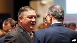 U.S. Secretary of State Mike Pompeo, left, speaks with Russia's Deputy Foreign Minister Igor Morgulov in Singapore, Aug. 4, 2018