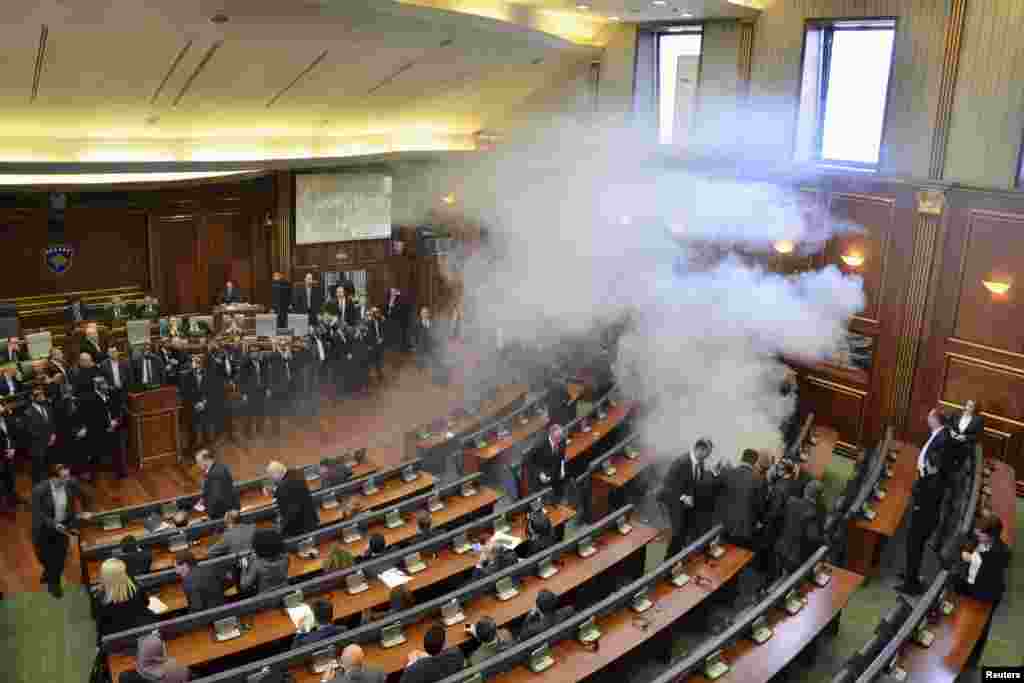 Opposition politicians release tear gas in parliament to obstruct a session in Pristina, Kosovo.