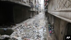 Children walk down a street in Aleppo, Syria, Feb. 12, 2016.