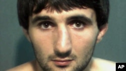 In this May 4, 2013 police mug provided by the Orange County Corrections Department in Orlando, Fla., shows Ibragim Todashev after his arrest for aggravated battery in Orlando.