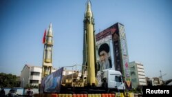 FILE PHOTO: A display featuring missiles and a portrait of Iran's Supreme Leader Ayatollah Ali Khamenei is seen at Baharestan Square in Tehran, Iran, Sept. 27, 2017.