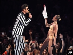 From left, Robin Thicke and Miley Cyrus perform "Blurred Lines" at the MTV Video Music Awards on Aug. 25, 2013, at the Barclays Center in the Brooklyn borough of New York.