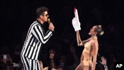 From left, Robin Thicke and Miley Cyrus perform "Blurred Lines" at the MTV Video Music Awards on Aug. 25, 2013, at the Barclays Center in the Brooklyn borough of New York.