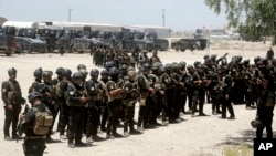 FILE - Iraq's elite counter-terrorism forces gather ahead of an operation to re-take the Islamic State-held City of Fallujah, outside Fallujah, Iraq, May 29, 2016. 