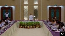 Myanmar President Thein Sein (C) speaks at the opening of a meeting for a Nationwide Cease-fire Agreement (NCA) between representatives of the Myanmar government and leaders of armed ethnic groups, in Naypyidaw, Myanmar, Sept. 9, 2015.