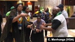 Ruling Zanu PF supporters celebrate in Harare, Aug. 3, 2018, after the Zimbabwe Electoral Commission declared their party the winner of Monday's polls in Zimbabwe.