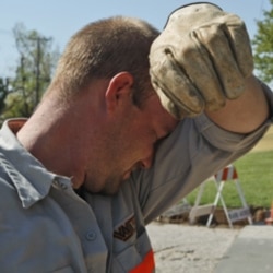 A worker making a road repair in Warr Acres, Oklahoma last week during a heat wave