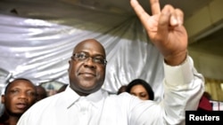 FILE - Felix Tshisekedi, leader of the Congolese main opposition party, was announced as the winner of the presidential elections. He gestures to his supporters at the party headquarters in Kinshasa, Democratic Republic of Congo, Jan. 10, 2019.