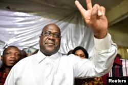 FILE - Felix Tshisekedi, leader of the Congolese main opposition party, was announced as the winner of the presidential elections. He gestures to his supporters at the party headquarters in Kinshasa, Democratic Republic of Congo, Jan. 10, 2019.