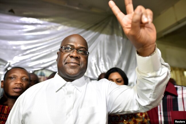 FILE - Felix Tshisekedi, leader of the Congolese main opposition party, was announced as the winner of the presidential elections. He gestures to his supporters at the party headquarters in Kinshasa, Democratic Republic of Congo, Jan. 10, 2019.